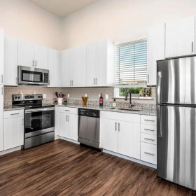 a kitchen with white cabinets