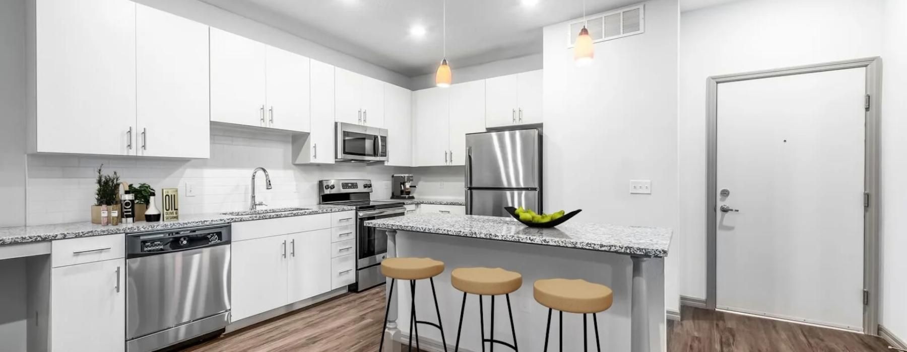 a kitchen with white cabinets