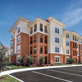 a large building with a parking lot
