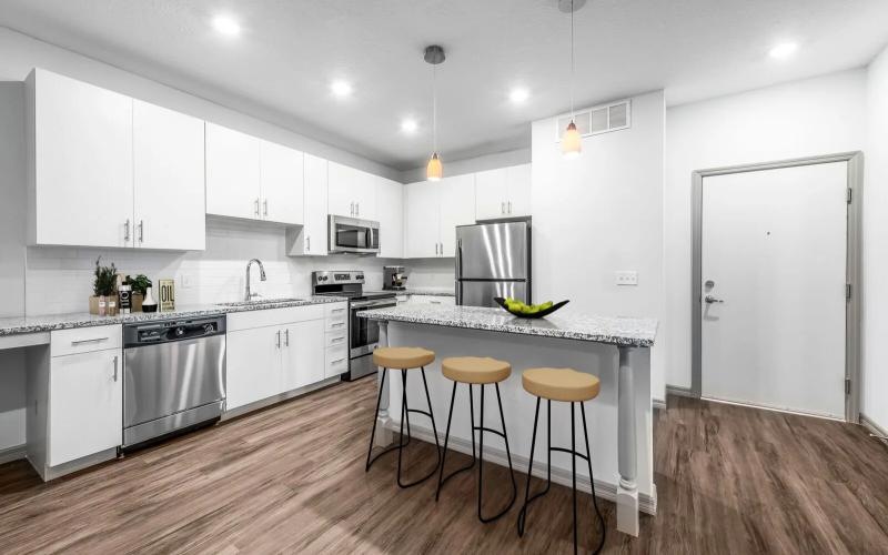 a kitchen with white cabinets